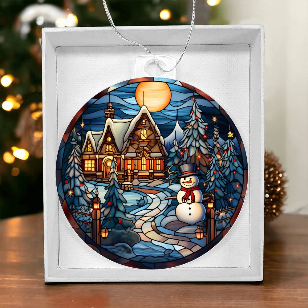 Christmas acrylic ornament with snowman, cozy cottage, and twinkling lights under a full moon in gift box.