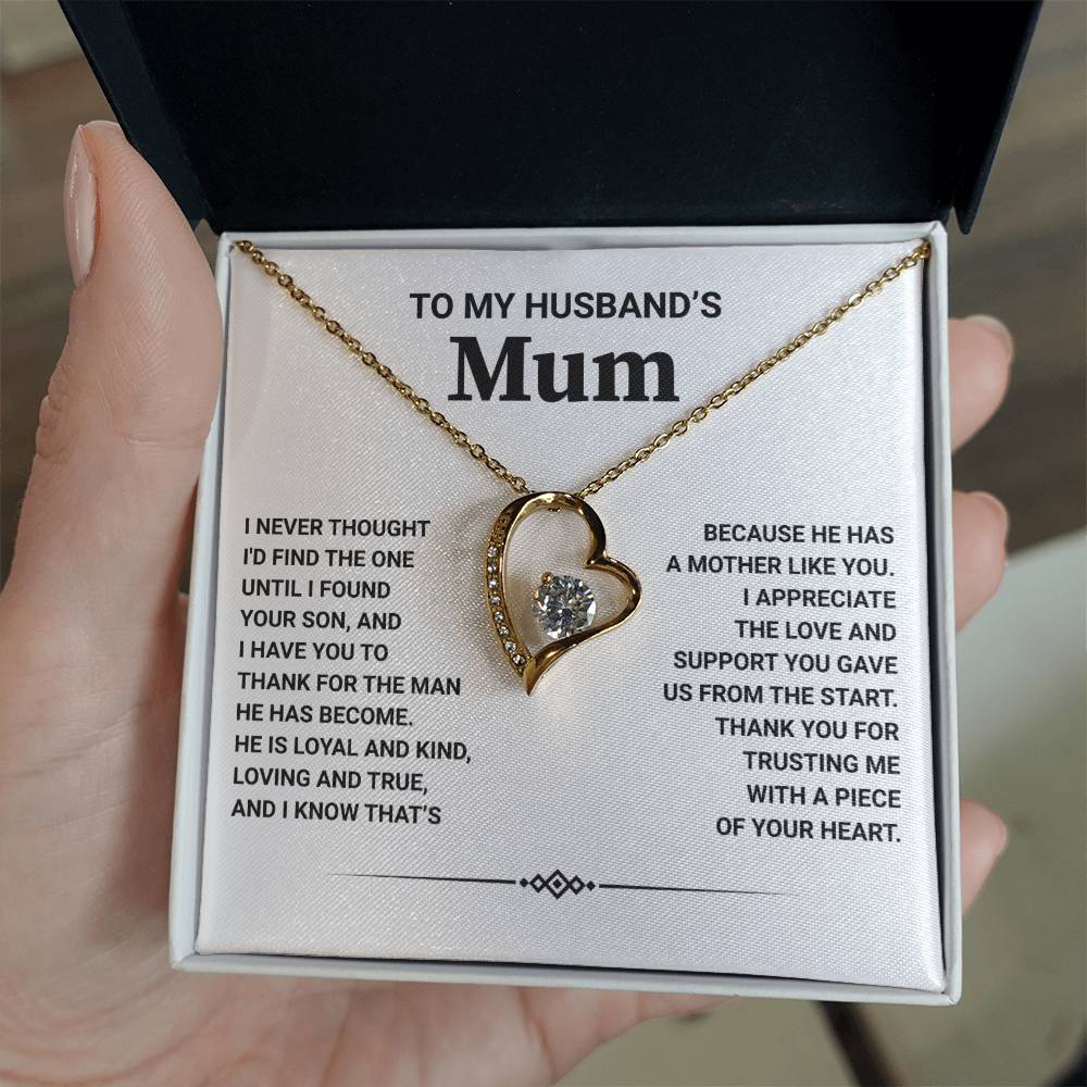 Gold heart pendant necklace in box with heartfelt message for husband's mum, showcasing appreciation and love.