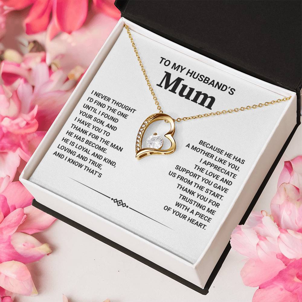 Forever Love Necklace in gift box for husband's mum with heartfelt message and pink flowers in background.