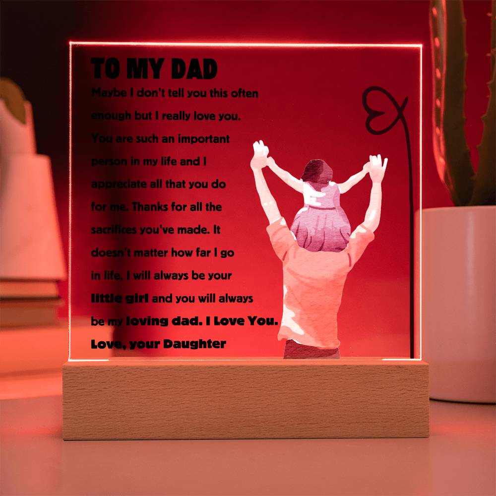 Square acrylic plaque with message "To My Dad - You Will Always Be My Loving Dad" on a lit wooden base, showing child on dad's shoulders.